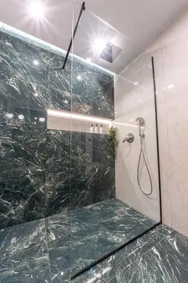 a bathroom with a shower with a glass door at Polis luxury apartment 4 in Athens