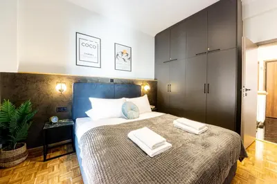 a bedroom with a bed with two towels on it at Polis luxury apartment 4 in Athens