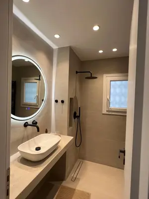 a bathroom with a sink and a mirror at CK Athens Fine Stay Apartments - Lux & Modern - 2 min from Metro in Athens