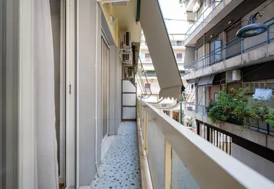 an empty hallway of a building with plants at LIV - Comfortable & Stylish Escape in Pagrati in Athens