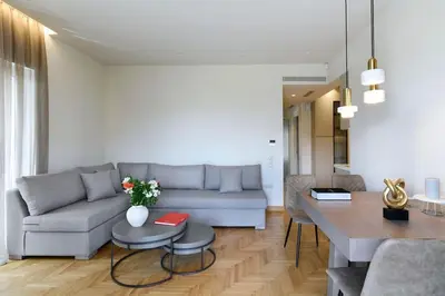 a living room with a couch and a table at Zana's cozy Apartment at Glifada in Athens