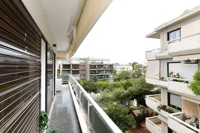 an apartment balcony with a view of a building at Zana's cozy Apartment at Glifada in Athens