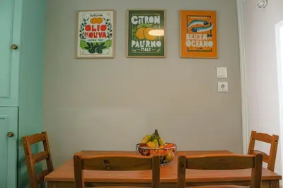 a dining room table with a bowl of bananas on it at Ampa's Home in Athens