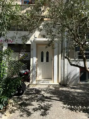a white door on the side of a building at Ampa's Home in Athens