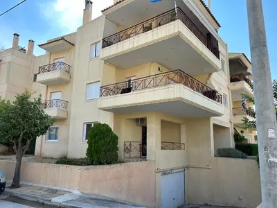 an apartment building with balconies on the side of it at Mesogaia Home Near ATH Airport in Markopoulo