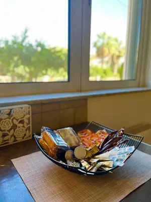 a bowl of food sitting on top of a table at Mesogaia Home Near ATH Airport in Markopoulo