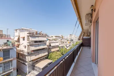 a balcony with a view of buildings at Beaming 2BR Apartment in Paleo Faliro by UPSTREET in Athens