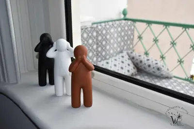 a group of toy people standing on a window sill at Gargaretta Suites Wildflower 1 Acropolis Museum District in Athens