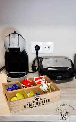 a wooden home baking box on a counter with a toaster at Gargaretta Suites Wildflower 1 Acropolis Museum District in Athens