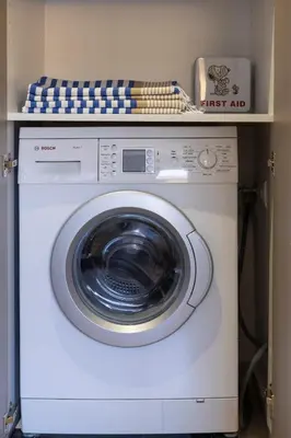 a white washing machine with a counter on top of it at Athome Athens Luxury Flat in Athens