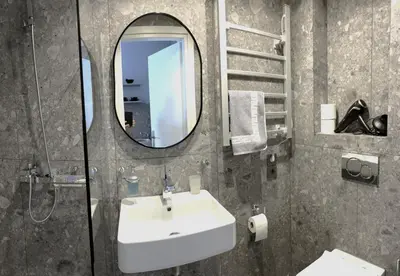 a bathroom with a sink and a mirror at Glyfada Relax 9 in Athens