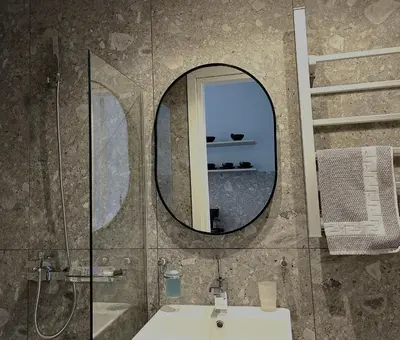 a bathroom with a mirror and a sink at Glyfada Relax 9 in Athens