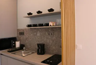 a kitchen with a sink and a counter top at Glyfada Relax 9 in Athens
