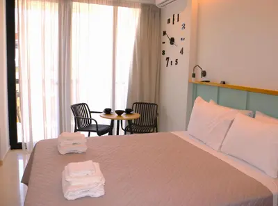 a bedroom with a bed with two towels on it at Glyfada Relax 9 in Athens