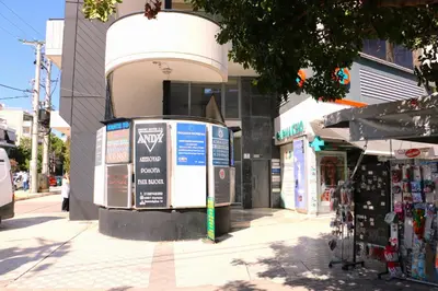 a street corner with a store on a city street at Glyfada Relax 8 in Athens