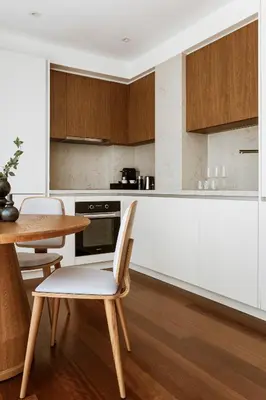 a kitchen with a table and a table and chairs at Likno Athens in Athens