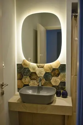 a bathroom with a sink and a mirror at Gargaretta Suites Wildflower 2 Acropolis Museum District in Athens