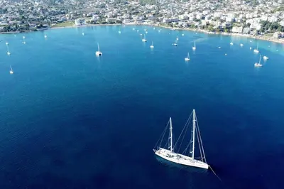 a sailboat in a large body of water with boats at Porto SkyLine in Porto Rafti