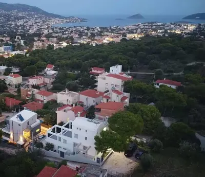 an aerial view of a city with white buildings at Porto SkyLine in Porto Rafti