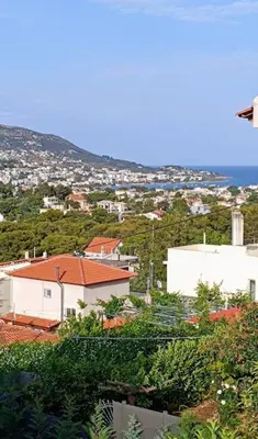 a view of a city with buildings and trees at Porto SkyLine in Porto Rafti