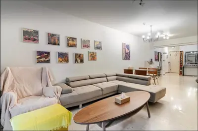 a living room with a couch and a table at Beach of Falio in Athens
