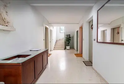 a hallway with a sink and a counter in a room at Beach of Falio in Athens