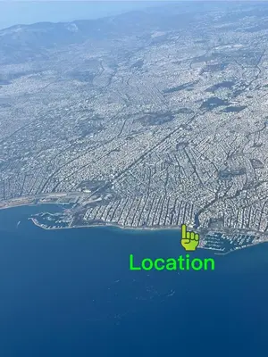 an aerial view of a city and the ocean at Beach of Falio in Athens