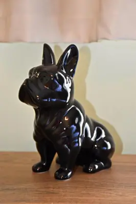 a black figurine of a dog sitting on a table at Gargaretta Suites Wildflower 3 Acropolis Museum District in Athens