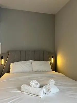 two towels on a bed with two pillows on it at Central Urban Suite by Zeussuites in Athens