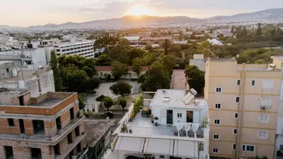 an aerial view of a city at sunset at MrK Rooftop 1 in Athens