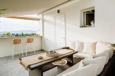 a living room with a couch and a table at MrK Rooftop 1 in Athens