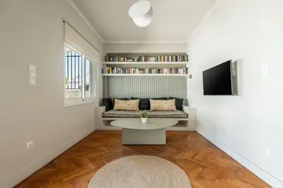 a living room with a couch and a table at Family 2BR Apt By National Archaeological Museum in Athens