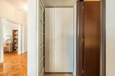 a closet with a glass door in a room at Family 2BR Apt By National Archaeological Museum in Athens