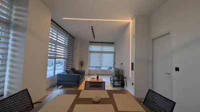 a living room with a table and a couch at Astak 2 in Piraeus