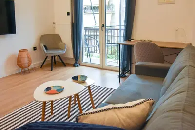 a living room with a couch and a table at Cozy apartment in Pireus in Piraeus