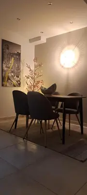 a table and two chairs in a room at 'Home Downtown' in Athens
