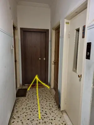 a hallway with a yellow pole in front of a door at Athens Stylish Renovated 62sqm Apartment for Families & Couples with Balcony in Quiet Area near City Center in Athens