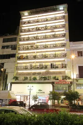 a tall building with a lot of balconies on it at Noufara in Piraeus