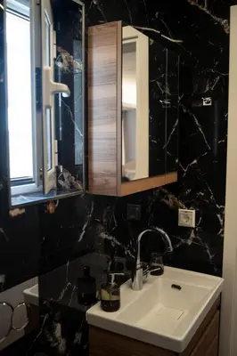 a bathroom with a sink and a mirror at Athens Horizon in Athens