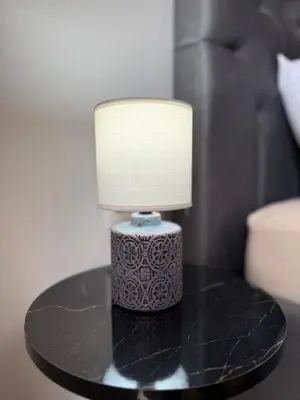 a lamp sitting on top of a table at Elliniko Luxury Apartment in Athens