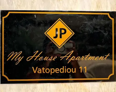 a sign that says my house experiment victoria at My house apartment jp in Athens