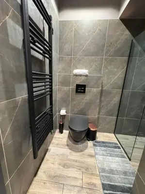 a bathroom with a shower with a toilet in it at My house apartment jp in Athens
