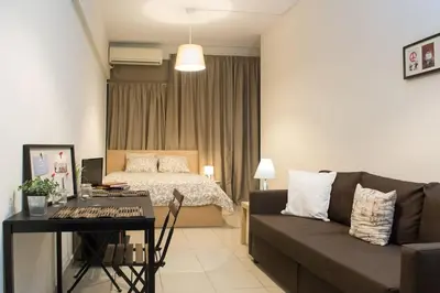 a living room with a couch and a bed at Angel - Cozy, renovated, studio in Athens heart in Athens