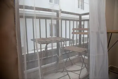 a balcony with a table and two chairs on it at Angel - Cozy, renovated, studio in Athens heart in Athens
