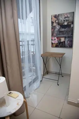 a room with a window and a table and a table at Angel - Cozy, renovated, studio in Athens heart in Athens