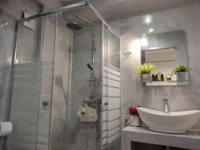 a bathroom with a sink and a shower at Angel's Yard in Athens Heart in Athens