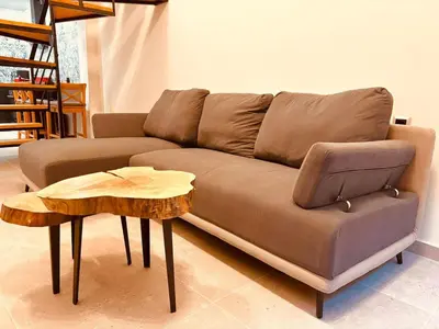 a brown couch with a end table and a coffee table at Loft Athens 1 - 55m2 in Athens
