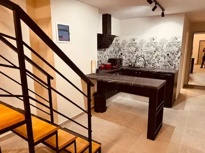 a kitchen with a counter with a sink in a room at Loft Athens 1 - 55m2 in Athens