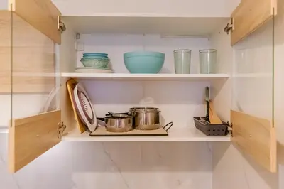 a kitchen with two pots and pans on a shelf at Sweet greek memories C in Athens