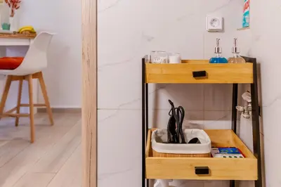 a wooden shelf with some items on it in a room at Sweet greek memories C in Athens